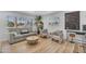 Comfortable living room with plenty of natural light, modern decor, and wood-look flooring at 6943 E Granada Rd, Scottsdale, AZ 85257