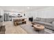 Open-concept living space with tile flooring and a cozy seating area adjacent to the kitchen at 6943 E Granada Rd, Scottsdale, AZ 85257