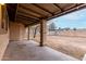 Covered back patio overlooking a large, enclosed backyard with block fencing for added privacy at 7017 W Beatrice St, Phoenix, AZ 85043