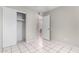 Functional bedroom featuring tiled flooring and a closet for easy storage at 7017 W Beatrice St, Phoenix, AZ 85043