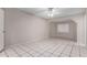 Cozy bedroom featuring tile flooring and a ceiling fan for added comfort at 7017 W Beatrice St, Phoenix, AZ 85043