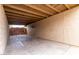 Covered carport featuring concrete flooring and privacy fencing at 7017 W Beatrice St, Phoenix, AZ 85043