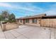 Cozy one-story home with a long driveway, fenced-in area, and a simple yet inviting facade at 7017 W Beatrice St, Phoenix, AZ 85043