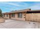 Charming single-level home with an extended driveway and fenced yard, blending functionality with curb appeal at 7017 W Beatrice St, Phoenix, AZ 85043