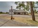 Charming home with a long porch, stone accents, and a spacious parking area at 7623 N Perryville Rd, Waddell, AZ 85355