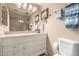 Updated bathroom with framed mirrors, modern vanity, new lighting and tiled shower at 7920 E Via Camello -- # 48, Scottsdale, AZ 85258