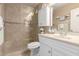 Bathroom featuring a glass-enclosed shower, a white vanity, and neutral tile at 7920 E Via Camello -- # 48, Scottsdale, AZ 85258