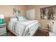 Comfortable bedroom with neutral paint, ceiling fan and window at 7920 E Via Camello -- # 48, Scottsdale, AZ 85258