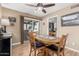 Cozy dining area with a wood table, chairs, and sliding glass doors leading to an outdoor patio at 7920 E Via Camello -- # 48, Scottsdale, AZ 85258