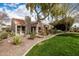 Charming home featuring desert landscaping, a red tile roof, and a well-manicured lawn at 7920 E Via Camello -- # 48, Scottsdale, AZ 85258