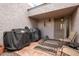 Tiled front entrance featuring an outdoor space with patio furniture and convenient grilling area at 7920 E Via Camello -- # 48, Scottsdale, AZ 85258