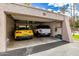 Spacious garage with two cars and shelving, providing ample storage at 7920 E Via Camello -- # 48, Scottsdale, AZ 85258