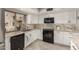 Updated kitchen features white cabinets, granite counters, stainless steel appliances and tile flooring at 7920 E Via Camello -- # 48, Scottsdale, AZ 85258