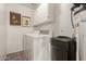 Well-lit laundry room featuring a washer, dryer, and ample storage space at 7920 E Via Camello -- # 48, Scottsdale, AZ 85258