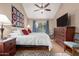 Spacious main bedroom with high ceilings, ceiling fan and sliding glass door to patio at 7920 E Via Camello -- # 48, Scottsdale, AZ 85258