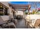 Lovely outdoor patio area with comfortable seating under a wooden pergola, perfect for entertaining at 7920 E Via Camello -- # 48, Scottsdale, AZ 85258