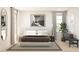 Bright bedroom featuring a plush bed, neutral decor, and a large window for natural light at 7999 W Griswold Dr, Peoria, AZ 85345