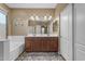 Bright bathroom featuring double sink vanity with granite counters, soaking tub, and neutral color palette at 8761 W Mary Ann Dr, Peoria, AZ 85382