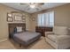 Cozy bedroom featuring natural light from windows and a comfortable armchair at 8761 W Mary Ann Dr, Peoria, AZ 85382