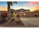 Stunning two-story home featuring a three-car garage, desert landscaping, and a private entrance at 8761 W Mary Ann Dr, Peoria, AZ 85382