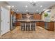 Spacious kitchen with granite countertops, stainless steel appliances, and a central island with bar stools at 8761 W Mary Ann Dr, Peoria, AZ 85382