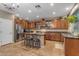Gourmet kitchen boasting granite countertops, stainless steel appliances, and a central island with seating at 8761 W Mary Ann Dr, Peoria, AZ 85382