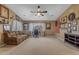Spacious living room with comfortable seating, large windows, and an American flag at 8761 W Mary Ann Dr, Peoria, AZ 85382