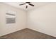 Bedroom featuring carpet, neutral walls, a ceiling fan and a window for natural lighting at 9394 E Silo Rd, Florence, AZ 85132