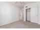 Inviting bedroom with carpeted floors, ceiling fan, and a closet with sliding doors for ample storage at 9922 E Onza Ave, Mesa, AZ 85212
