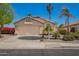 Charming home featuring a two-car garage, desert landscaping, and neutral color palette at 9922 E Onza Ave, Mesa, AZ 85212