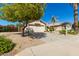 Charming single-story home with desert landscaping, a mature tree, and an inviting curb appeal at 9922 E Onza Ave, Mesa, AZ 85212