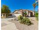 Inviting single-story home featuring well-maintained desert landscaping and a welcoming entrance at 9922 E Onza Ave, Mesa, AZ 85212