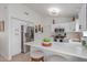 Bright kitchen featuring white cabinets, stainless steel appliances, and a center island with seating at 9922 E Onza Ave, Mesa, AZ 85212