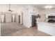 Open concept kitchen featuring stainless steel appliances, tile flooring, and ample counter space at 9922 E Onza Ave, Mesa, AZ 85212