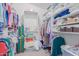 Spacious walk-in closet featuring ample shelving and hanging space for optimal organization at 9922 E Onza Ave, Mesa, AZ 85212