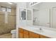 Well-lit bathroom with a tiled walk-in shower and vanity storage at 10401 N Saguaro Blvd # 130, Fountain Hills, AZ 85268