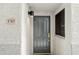 Close-up of the front door with the unit number and a modern light fixture at 10401 N Saguaro Blvd # 130, Fountain Hills, AZ 85268