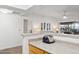 Bright kitchen with a breakfast bar overlooking the living room at 10401 N Saguaro Blvd # 130, Fountain Hills, AZ 85268