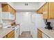Functional kitchen with white appliances and ample cabinet storage at 10401 N Saguaro Blvd # 130, Fountain Hills, AZ 85268