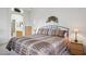 Cozy bedroom showcases a view into an en-suite bath and a comfortable bed at 10401 N Saguaro Blvd # 130, Fountain Hills, AZ 85268