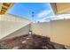 Back patio featuring landscaping and a block wall for added privacy and security at 10909 W Santa Fe Dr, Sun City, AZ 85351