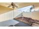 Enclosed back patio with ceiling fan, offering a private outdoor living space at 10909 W Santa Fe Dr, Sun City, AZ 85351