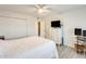 Comfortable bedroom featuring a ceiling fan, television, and closet for ample storage at 10909 W Santa Fe Dr, Sun City, AZ 85351