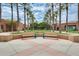 Benches invite you to relax in this meticulously kept community center with lush landscaping and shady palm trees at 10909 W Santa Fe Dr, Sun City, AZ 85351