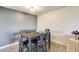 Dining room with a wooden table, six chairs, and a combination of gray and white paint at 10909 W Santa Fe Dr, Sun City, AZ 85351
