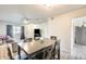 Open-concept dining area that connects to the kitchen and living room, creating a spacious feel at 10909 W Santa Fe Dr, Sun City, AZ 85351