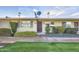 Inviting single-story home featuring well-maintained landscaping and a charming front entrance at 10909 W Santa Fe Dr, Sun City, AZ 85351