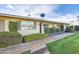 Quaint single-story property featuring mature landscaping and a welcoming entrance at 10909 W Santa Fe Dr, Sun City, AZ 85351