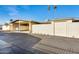 Single story exterior featuring a carport, single car garage and palm trees at 10909 W Santa Fe Dr, Sun City, AZ 85351