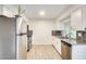 Bright kitchen features sleek stainless steel appliances and ample cabinet space at 10909 W Santa Fe Dr, Sun City, AZ 85351